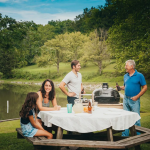 Primo Oval XL 400 Ceramic Kamado Grill On Curved Cypress Table With Stainless Steel Grates - PGCXLH - Image 4